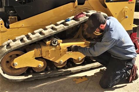 cat mini excavator track adjustment|track tension for mini excavators.